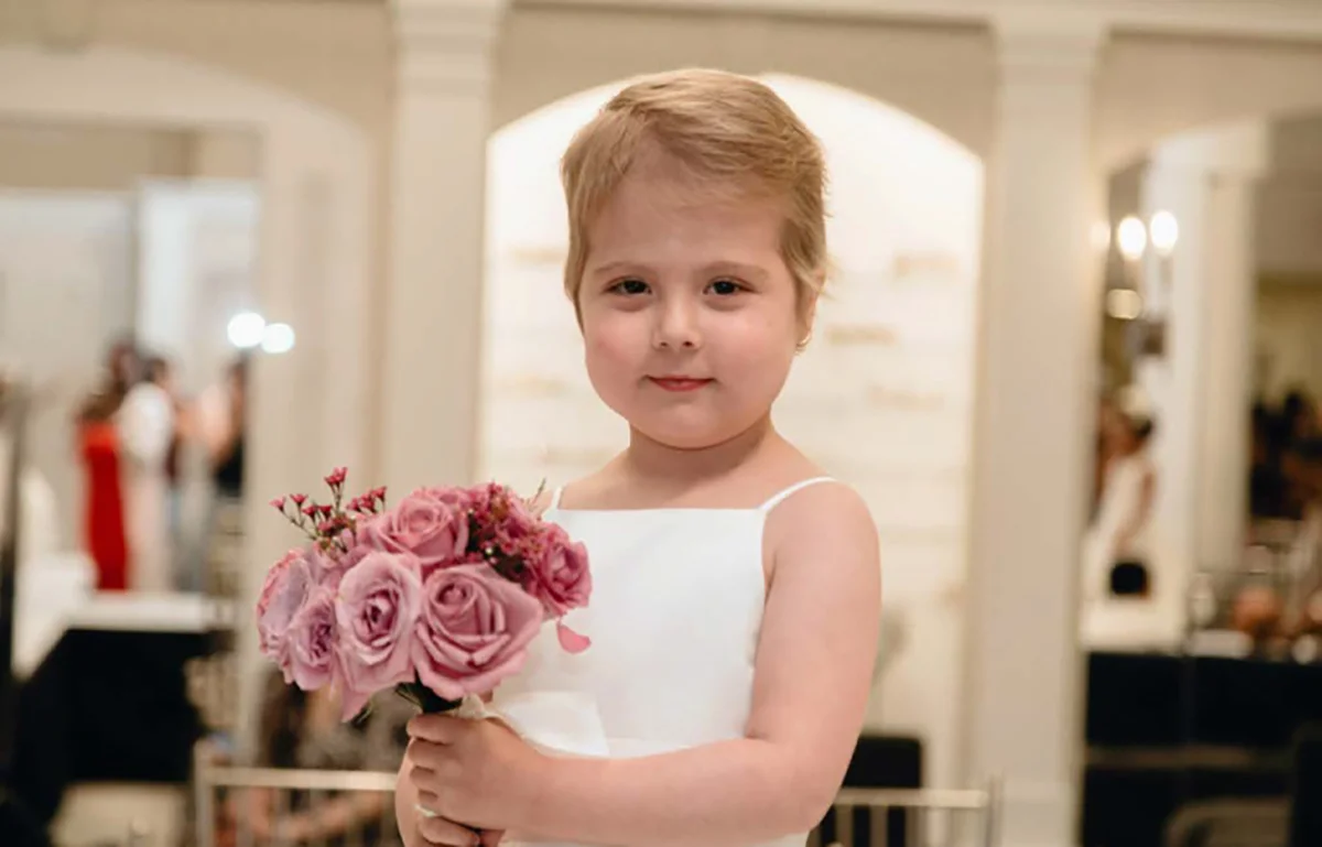Young girl holding flowers