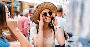person putting sunglasses on.
