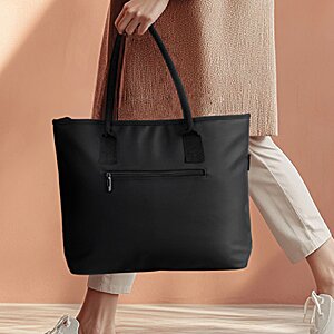 Additional Image 3 - a person carrying a black bag