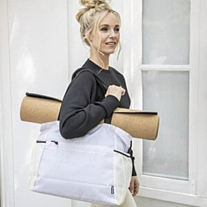 Additional Image 1 - a woman carrying a bag