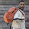 Additional Thumbnail Image 1 - a man carrying a backpack