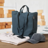 Additional Thumbnail Image 4 - a blue bag and a cap on a table