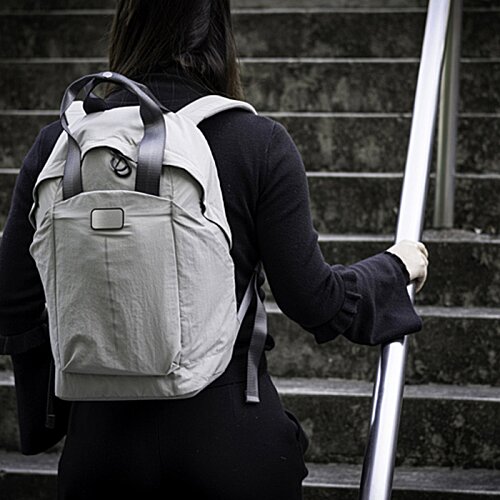 Additional Image 5 - a person with a backpack walking up stairs