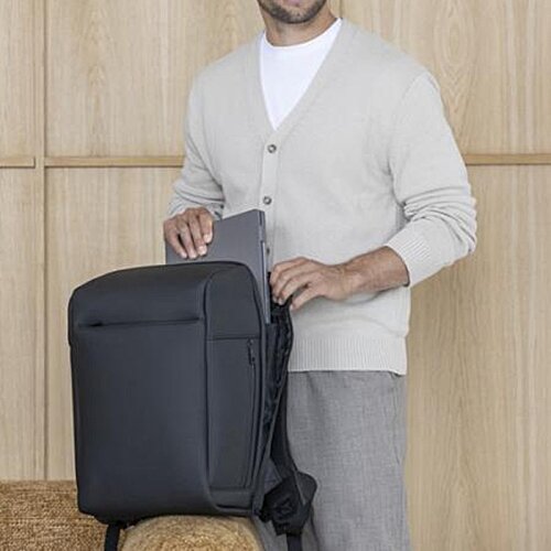 Additional Image 13 - a man holding a suitcase