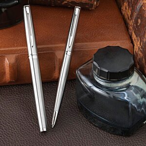 Additional Image 3 - a pair of metal sticks next to a black ink bottle