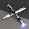 a pen with a light on it