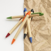 a group of colored pencils on a brown paper