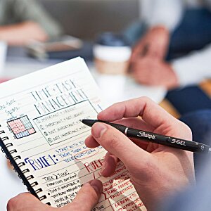 Additional Image 4 - a person writing on a notebook