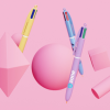 a group of objects on a pink background