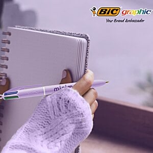 Additional Image 5 - a hand holding a pen and notebook