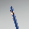 a close up of a blue and gold pen