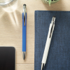 a pen and a notebook on a desk