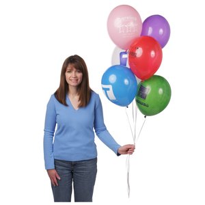 Additional Image 3 - a woman holding a bunch of balloons