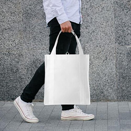 Additional Image 1 - a person holding a white bag