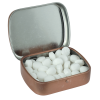 a small metal box with white pebbles inside