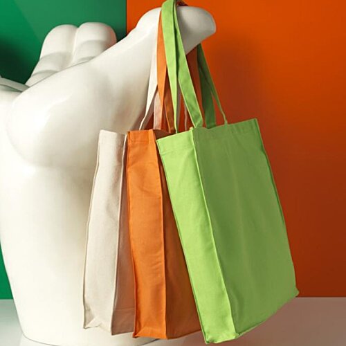 Additional Image 3 - a white statue holding several bags