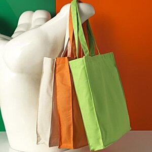 Additional Image 3 - a white statue holding several bags