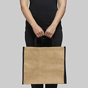 Additional Image 1 - a person holding a brown bag