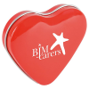 a red heart shaped box with a white star and a white star