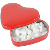 a red heart shaped box with white objects inside