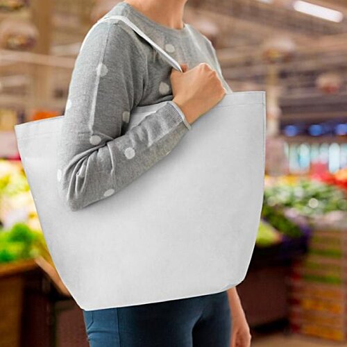 Additional Image 11 - a woman holding a white shopping bag