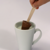 Additional Image 5 - a hand holding a wooden stick in a cup of milk