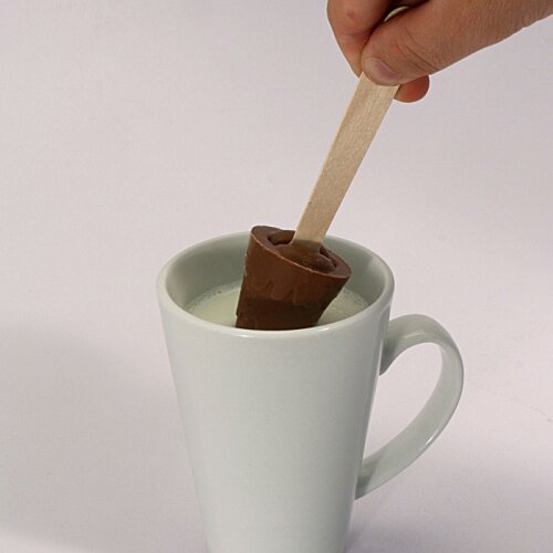 Additional Image 1 - a hand holding a wooden stick in a cup of milk