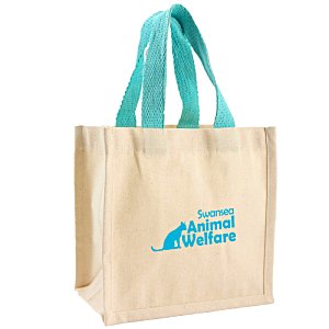 Additional Image 1 - a beige bag with blue handles