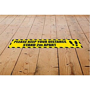 Additional Image 2 - a yellow sign on a wooden floor