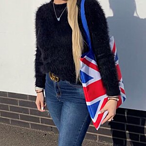 Additional Image 2 - a woman walking with a flag