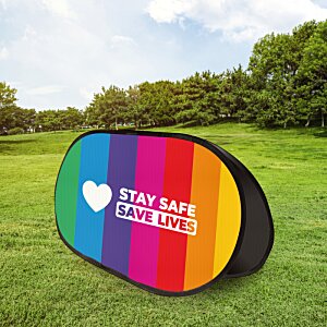 Additional Image 1 - a rainbow colored oval object on a grassy field