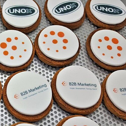 Additional Image 1 - a group of cookies with white and orange designs