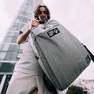 Additional Image 5 - a person carrying a large bag
