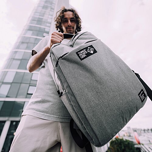 Additional Image 5 - a person carrying a large bag