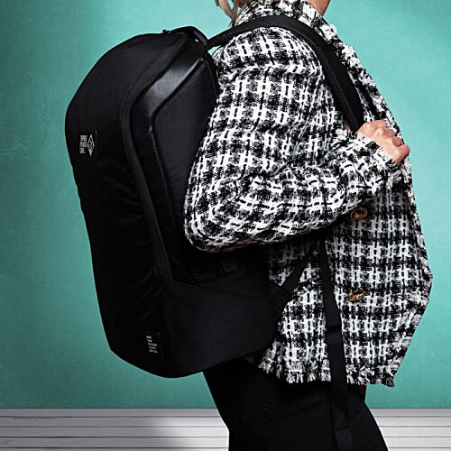 Additional Image 32 - a person carrying a backpack