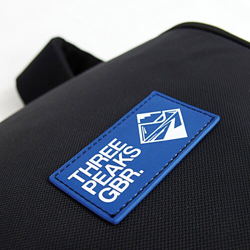 Additional Image 3 - a blue tag on a black bag