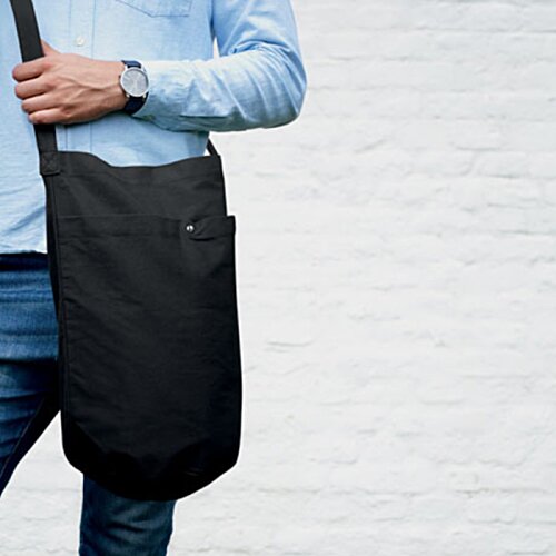 Additional Image 3 - a man carrying a bag