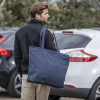 a person carrying a blue bag