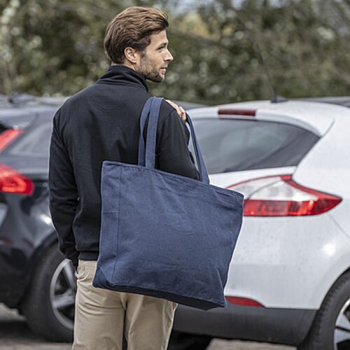 Additional Image 3 - a person carrying a blue bag