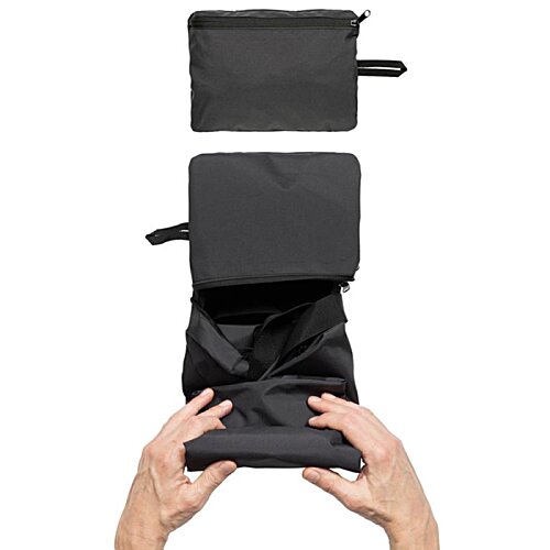 Additional Image 2 - a person holding a black object