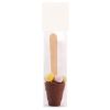 a small brown cup with a stick in it