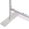 a white metal pole with blue dots