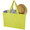 a green bag with a hat and a book