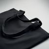 a black bag on a white surface