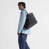 Additional Image 3 - a man carrying a bag