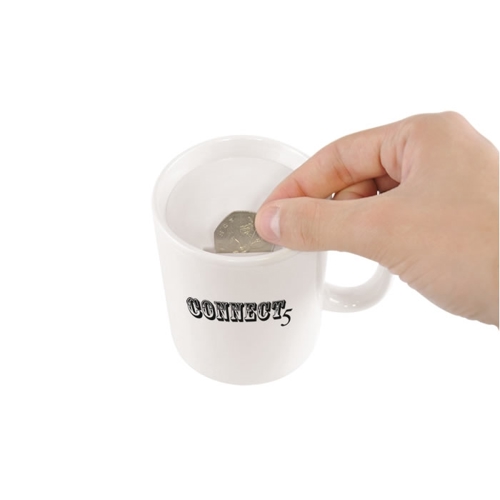 Additional Image 1 - a hand holding a spoon in a white cup
