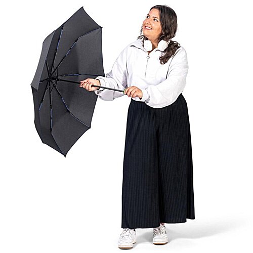 Additional Image 9 - a woman holding an umbrella
