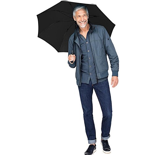 Additional Image 5 - a man holding an umbrella