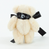 a stuffed animal with black ribbon