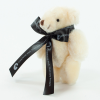 a stuffed animal with a black bow